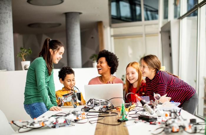 students at computer smiling
